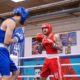 Bokswedstrijd tijdens het Blue Light United Event met deelname van politieboksers, begeleid door gedelegeerde trainer Marcel van Boxing University Breda.